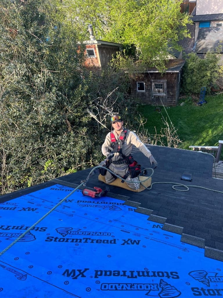 Vision Roofing crew member on a roofing project